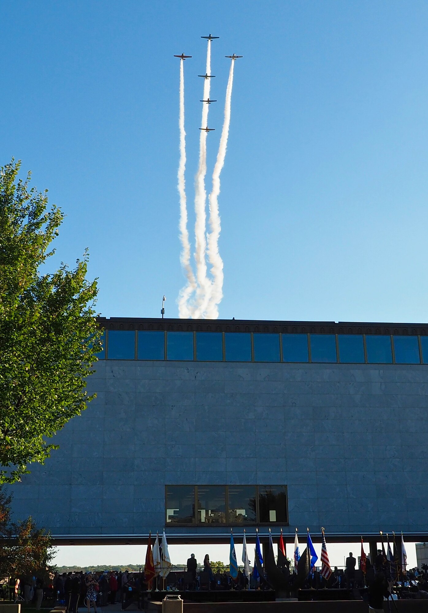 A formation of WW II era AT-6 aircraft perform a flyover at the Minnesota Medal of Honor Memorial groundbreaking ceremony Oct. 3.