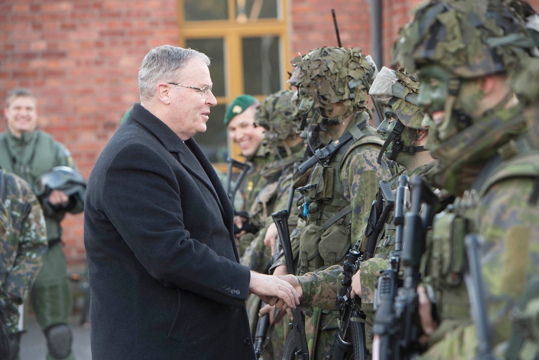 Deputy Defense Secretary Bob Work greets Finnish Defense Forces in Helsinki, Finland, Oct. 6, 2016. DoD photo by Navy Petty Officer 1st Class Tim D. Godbee