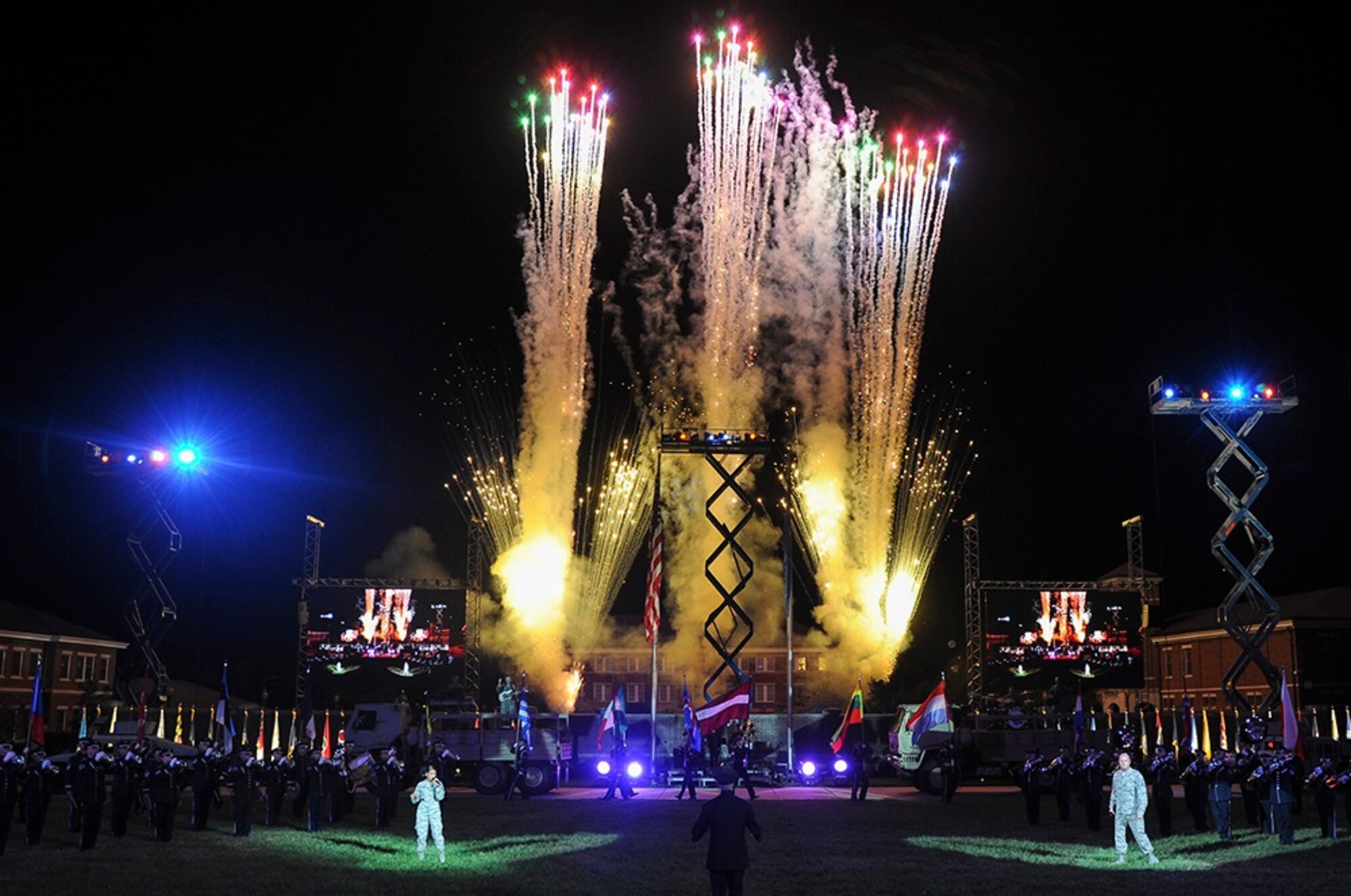 Fireworks light up the night sky as members of the U.S. Air Force Band's Max Impact rock group perform during the 2016 Air Force Tattoo Sept. 22, 2016, on the Ceremonial Lawn, Joint Base Anacostia Bolling, Washington, D.C. (U.S. Air Force photo/Jim Lotz)