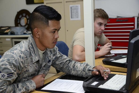 U.S. Air Force Airmen 1st Class Allan Calangan and Chandler Brown, 755th Aircraft Maintenance Squadron aerospace propulsion apprentices, work on a progress check exam during a course at the 372nd Training Squadron, Detachment 11 at Davis-Monthan Air Force Base, Ariz., Oct. 3, 2016. The students and teacher complete the progress check exams to ensure material comprehension. (U.S. Air Force photo by Senior Airman Betty R. Chevalier)