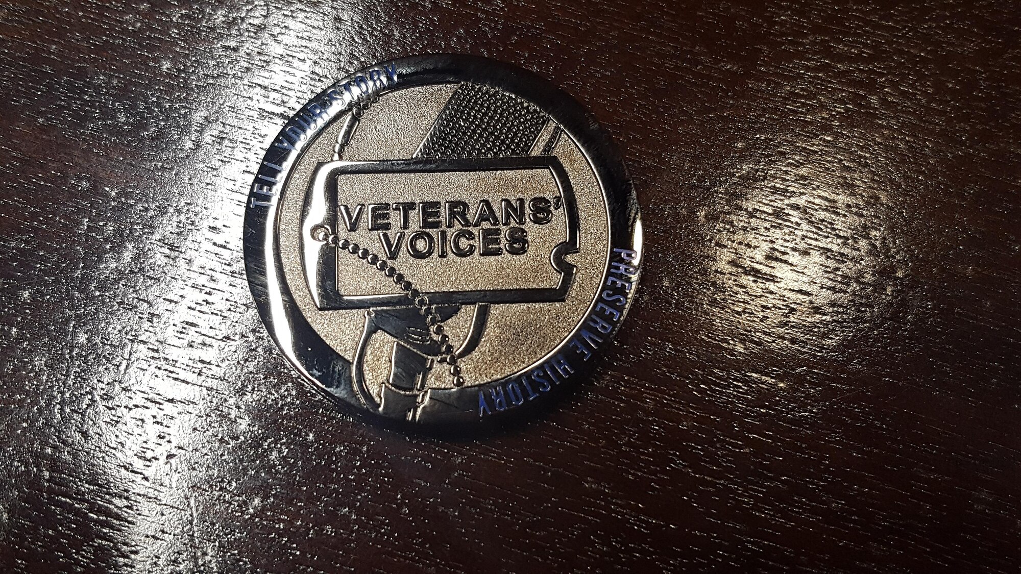 Veterans are given a copy of their interview and a Veterans’ Voice Project coin as an appreciation for sharing their military experiences. (U.S. Air Force photo/Stacey Geiger)