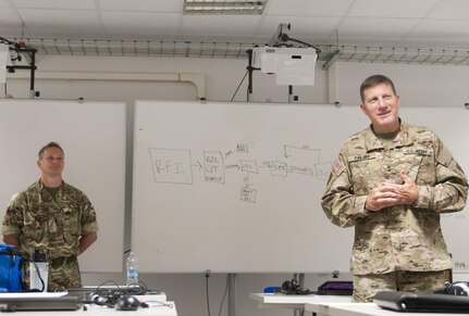 Maj. Gen. Mark W. Palzer, commanding general of the 79th Sustainment Command (Support), speaks to his troops while a British soldier from the 102 Logistic Brigade looks on Sept. 17 during Exercise Lion Focus '16 in Vicenza, Italy. Members of the 102 Logistic Brigade augmented the 79th SSC during the Joint, multinational exercise. (U.S. Army Photo by Sgt. 1st Class Alexandra Hays, 79th Sustainment Command (Support).