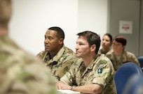 British army Brig. Gen. David Eastman, commanding general of the 102 Logistic Brigade, right, and Col. Vincent Buggs, 79th Sustainment Command (Support) Supports Operation Officer, left, attend a shift change briefing during Exercise Lion Focus '16 Sept. 20, 2016, in Vicenza, Italy. (U.S. Army photo by Sgt. 1st Class Alexandra Hays, 79th Sustainment Command (Support).