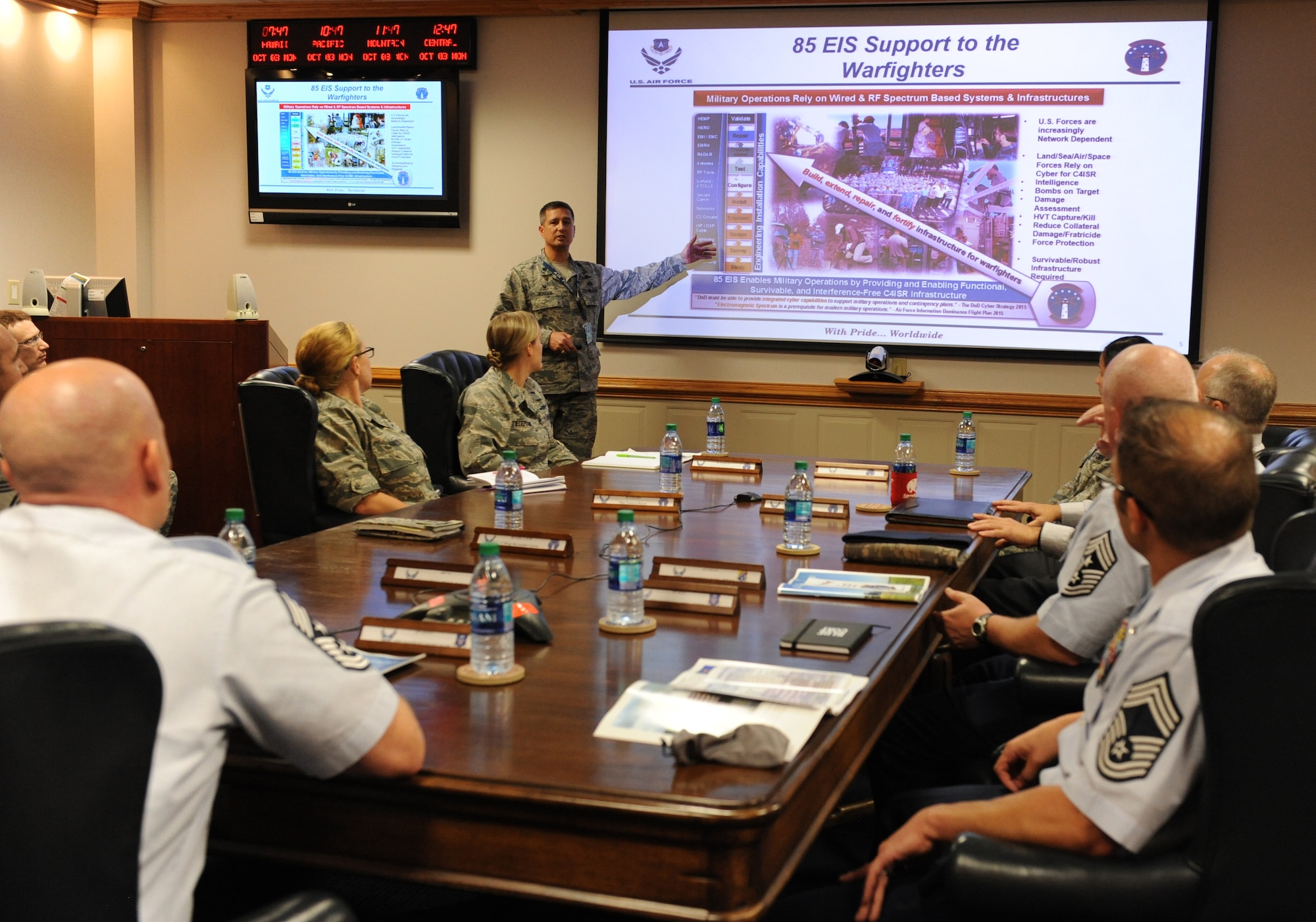 Lt. Col. Scott Jensen, 85th Engineering Installation Squadron commander, delivers a mission brief at Maltby Hall to 24th Air Force, Lackland Air Force Base, Texas, leadership during a site visit Oct. 3, 2016, on Keesler Air Force Base, Miss. The 24th AF leadership visited Keesler to familiarize themselves with how the Air Force trains cyber career field Airmen. (U.S. Air Force photo by Kemberly Groue/Released)
