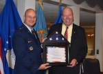 Defense Logistics Agency Aviation and Defense Supply Center Richmond; Virginia Commander Air Force Brig. Gen. Allan Day presents Deputy Chief Counsel Don Tracy, Defense Logistics Agency Counsel – Aviation with the Exceptional Civilian Service Award during Tracy’s retirement ceremony Sept. 29, 2016, at the historic Bellwood Club on DSCR.