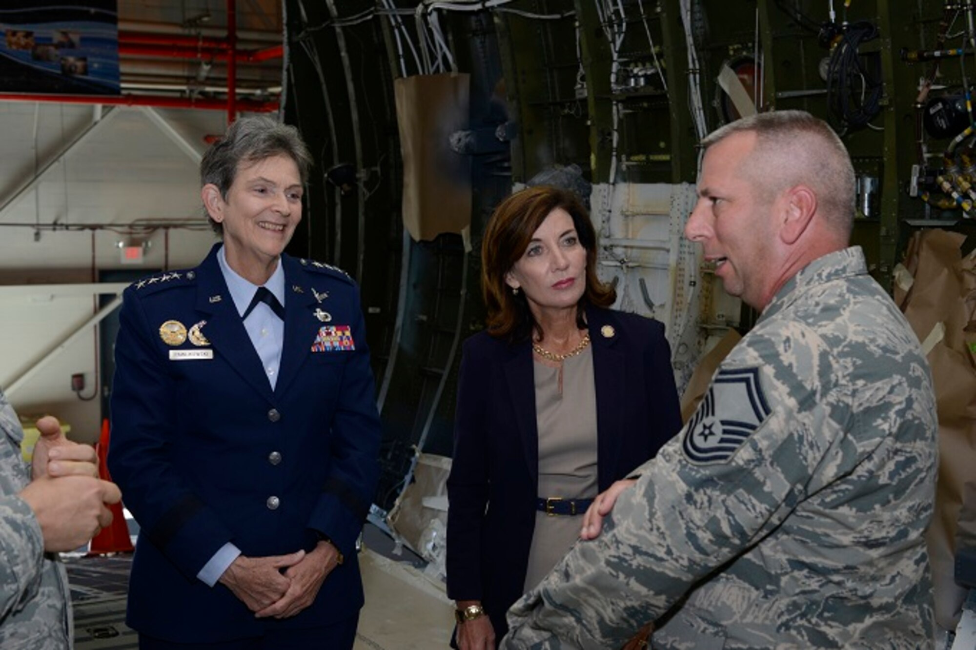 Senior Master Sgt. Dennis Pitcher briefs Gen. Ellen M. Pawlikowski, Air Force Materiel Command commander, and New York Lieutenant Governor Kathy Hochul on the C-5M interior refurbishment mission Oct. 5 at Stewart Air National Guard Base, N.Y. The two leaders met with Airmen and observed operations at the New York Air National Guard's 105th Airlift Wing. A total of 52 C-5 aircraft are being converted to the C-5M Super Galaxy configuration which includes avionics upgrades, new engines and other performance and reliability enhancements. The last step is a complete 40-day refurbishment of the aircraft interior performed by Total Force Airmen at Stewart. Pitcher is superintendent of C-5M refurb operations with the 105th AW. (U.S. Air Force photo/Staff Sgt. Julio A. Olivencia Jr.)