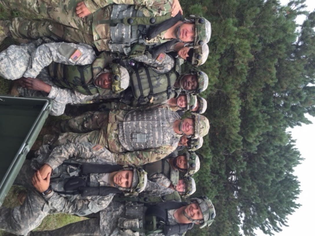 FORT MCCOY, Wis. – U.S. Army Reserve Soldiers, with the 705th Transportation Company, 643rd Regional Support Group, 310th Sustainment Command (Expeditionary) from Dayton, Ohio, and the 652nd Multi-Role Bridge Company (MRBC), 397th Engineer Battalion, 372nd Engineer Brigade, 416th Theater Engineer Command, from Hammond, Wis., stand with Brig. Gen. Vincent B. Barker as they work together to conduct rafting operations while participating in Combat Support Training Exercise (CSTX) 86-15-03, at Lake Petenwell outside of Fort McCoy, Wis., August 19, 2016. Nearly 9,000 service members from across the country participated in CSTX 86-16-03 hosted by the 86th Training Division.