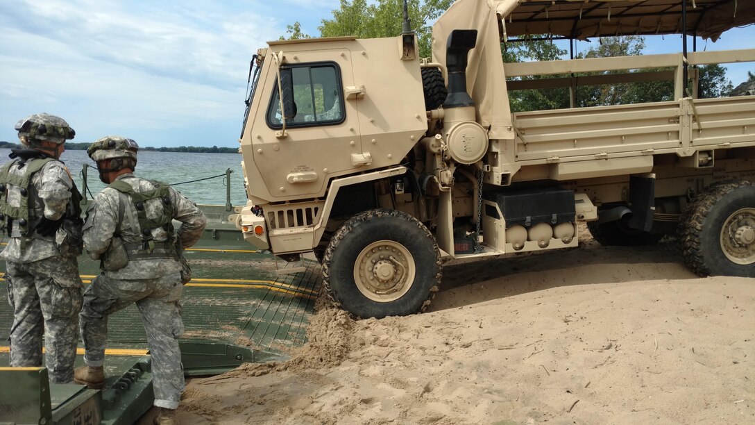 FORT MCCOY, Wis. – U.S. Army Reserve Soldiers, with the 705th Transportation Company, 643rd Regional Support Group, 310th Sustainment Command (Expeditionary) from Dayton, Ohio, and the 652nd Multi-Role Bridge Company (MRBC), 397th Engineer Battalion, 372nd Engineer Brigade, 416th Theater Engineer Command, from Hammond, Wis., work together to conduct rafting operations while participating in Combat Support Training Exercise (CSTX) 86-15-03, at Lake Petenwell outside of Fort McCoy, Wis., August 19, 2016. Nearly 9,000 service members from across the country participated in CSTX 86-16-03 hosted by the 86th Training Division.