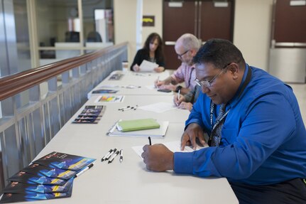 Army civilians take a cybersecurity quiz during a Cybersecurity Expo hosted by the U.S. Army Forces Command and U.S. Army Reserve Command headquarters, Oct. 3, 2016, at Fort Bragg, N.C. The expo was held to increase awareness of cybersecurity threats and how they impact day-to-day Army operations. (U.S. Army photo by Timothy L. Hale)(Released)