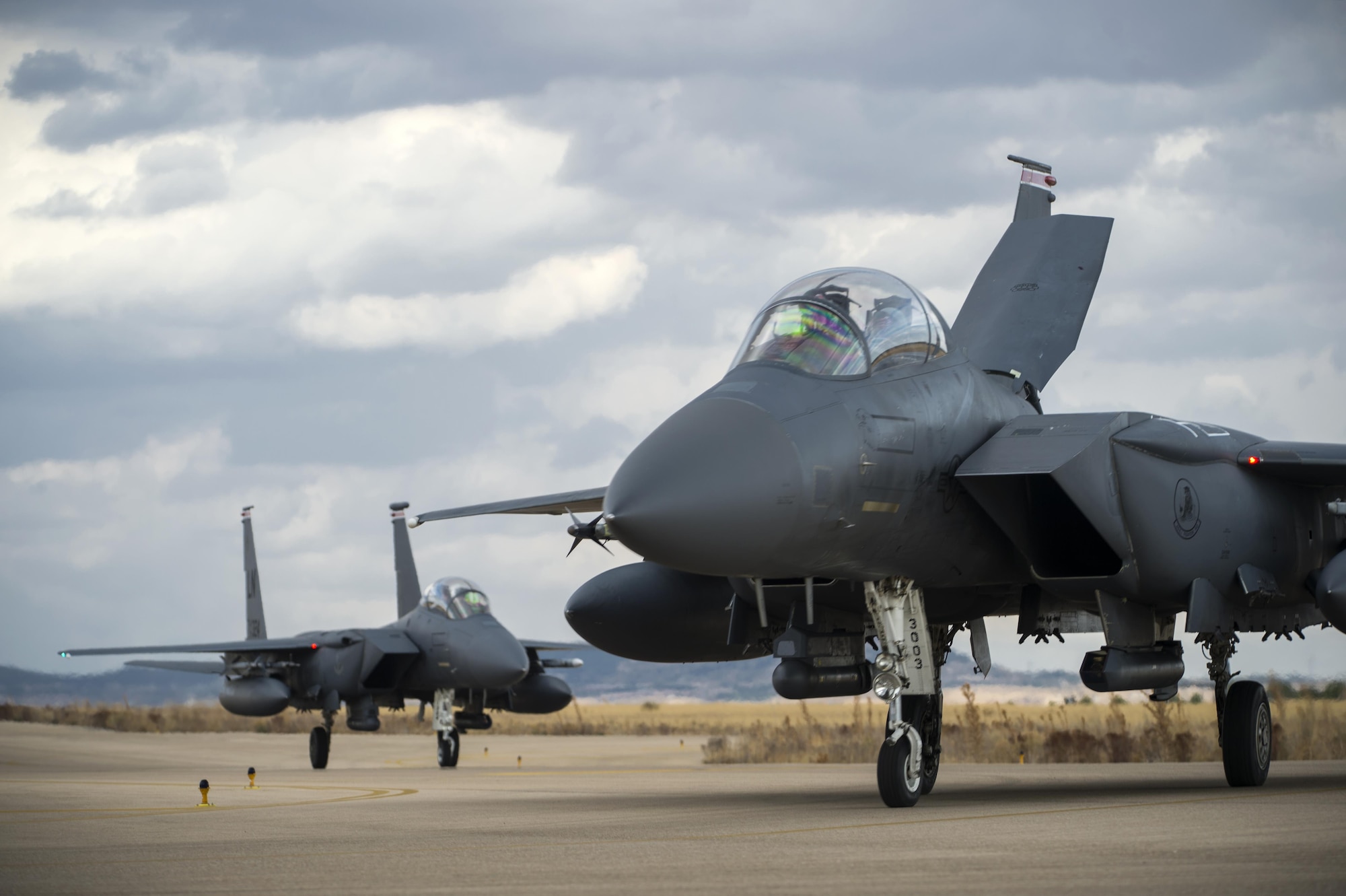 F-15E Strike Eagles, assigned to the 494th Fighter Squadron from Royal Air Force Lakenheath, England, taxi in after a sortie in support of Tactical Leadership Programme 16-3 at Los Llanos Air Base, Spain, Sept. 26. Throughout its 39-year history, TLP has become the focal point for NATO’s Allied Air Forces tactical training, developing the knowledge and leadership skills necessary to face today's tactical challenges in the air. (U.S. Air Force photo/ Staff Sgt. Emerson Nuñez)