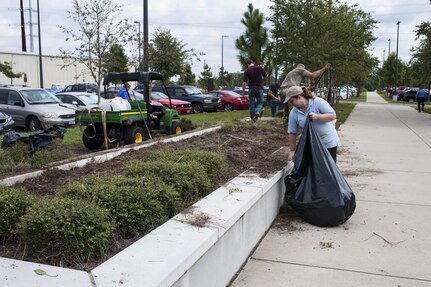 U.S. Army Reserve personnel with the Army Reserve Installation Management Directorate clean out old plants and bushes from existing planter boxes replacing them with Spring, Summer, and Fall perennials as part of National Public Lands Day at the U.S. Army Forces Command/U.S. Army Reserve Command headquarters, Sept. 28, 2016, at Fort Bragg, N.C. Jonelle Kimbrough, a communications specialist with ARIMD, said USARC received a $4,000 grant through the NPLD program. NPLD is the nation's largest, single-day volunteer effort for public lands to promote environmental stewardship. (U.S. Army photo by Timothy L. Hale)(Released)