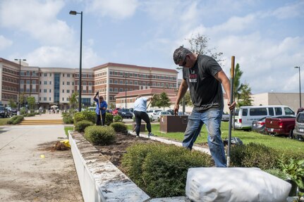 U.S. Army Reserve personnel with the Army Reserve Installation Management Directorate clean out old plants and bushes from existing planter boxes replacing them with Spring, Summer, and Fall perennials as part of National Public Lands Day at the U.S. Army Forces Command/U.S. Army Reserve Command headquarters, Sept. 28, 2016, at Fort Bragg, N.C. Jonelle Kimbrough, a communications specialist with ARIMD, said USARC received a $4,000 grant through the NPLD program. NPLD is the nation's largest, single-day volunteer effort for public lands to promote environmental stewardship. (U.S. Army photo by Timothy L. Hale)(Released)