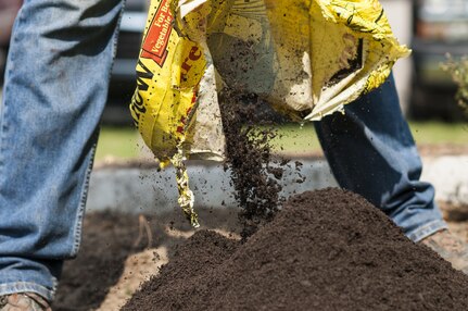 U.S. Army Reserve personnel with the Army Reserve Installation Management Directorate clean out old plants and bushes from existing planter boxes replacing them with Spring, Summer, and Fall perennials as part of National Public Lands Day at the U.S. Army Forces Command/U.S. Army Reserve Command headquarters, Sept. 28, 2016, at Fort Bragg, N.C. Jonelle Kimbrough, a communications specialist with ARIMD, said USARC received a $4,000 grant through the NPLD program. NPLD is the nation's largest, single-day volunteer effort for public lands to promote environmental stewardship. (U.S. Army photo by Timothy L. Hale)(Released)