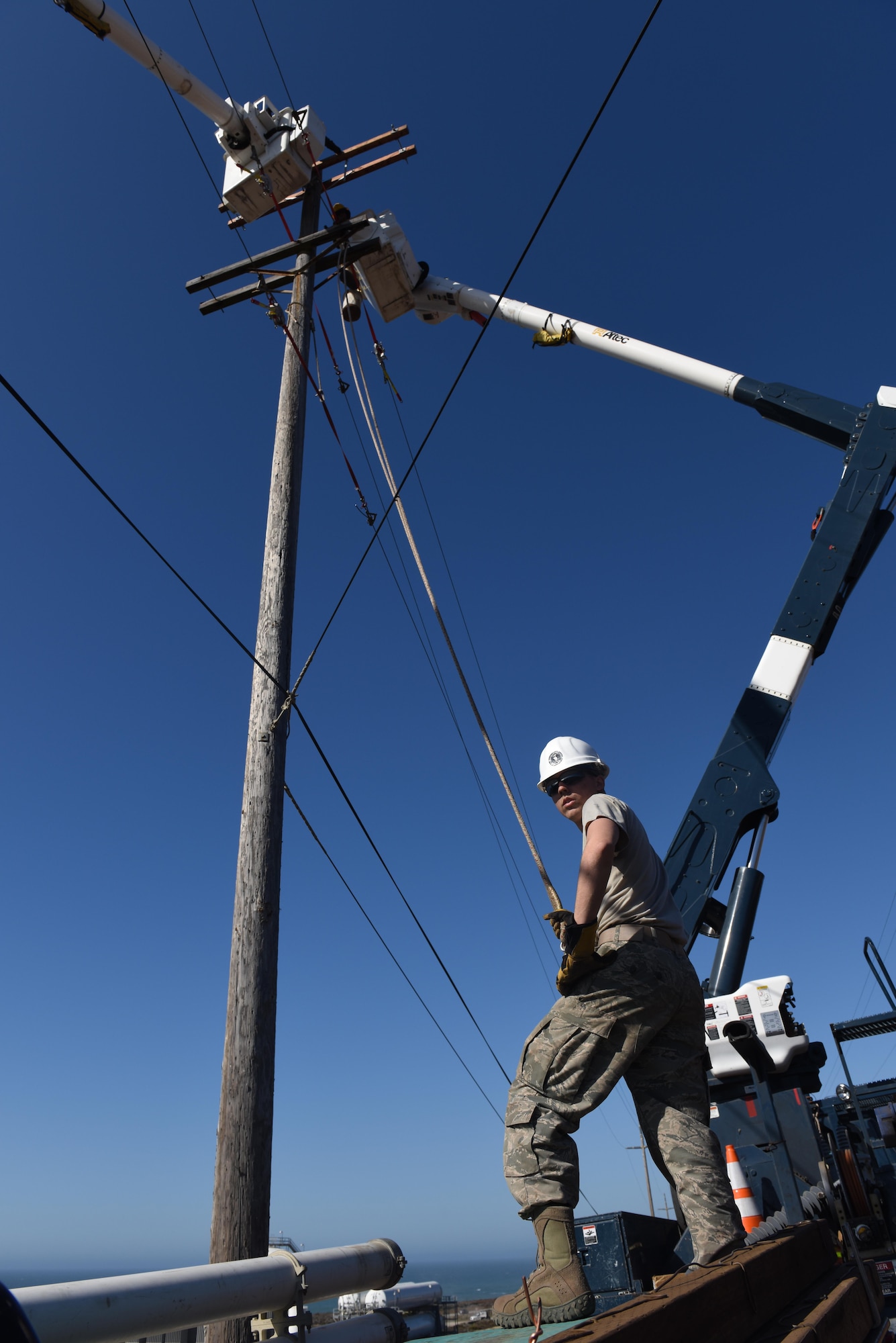 Airman 1st Class Hunter Allen, 30th Civil Engineer Squadron electrical systems apprentice, works ground support for a buck arm replacement Oct. 5, 2016, Vandenberg Air Force Base, Calif. With the fire extinguished, the wing’s first priority is to complete damage assessments of infrastructure, facilities, and range equipment in order to characterize the scope of the damage caused by the fires. (U.S. Air Force photo by Senior Airman Ian Dudley/Released)