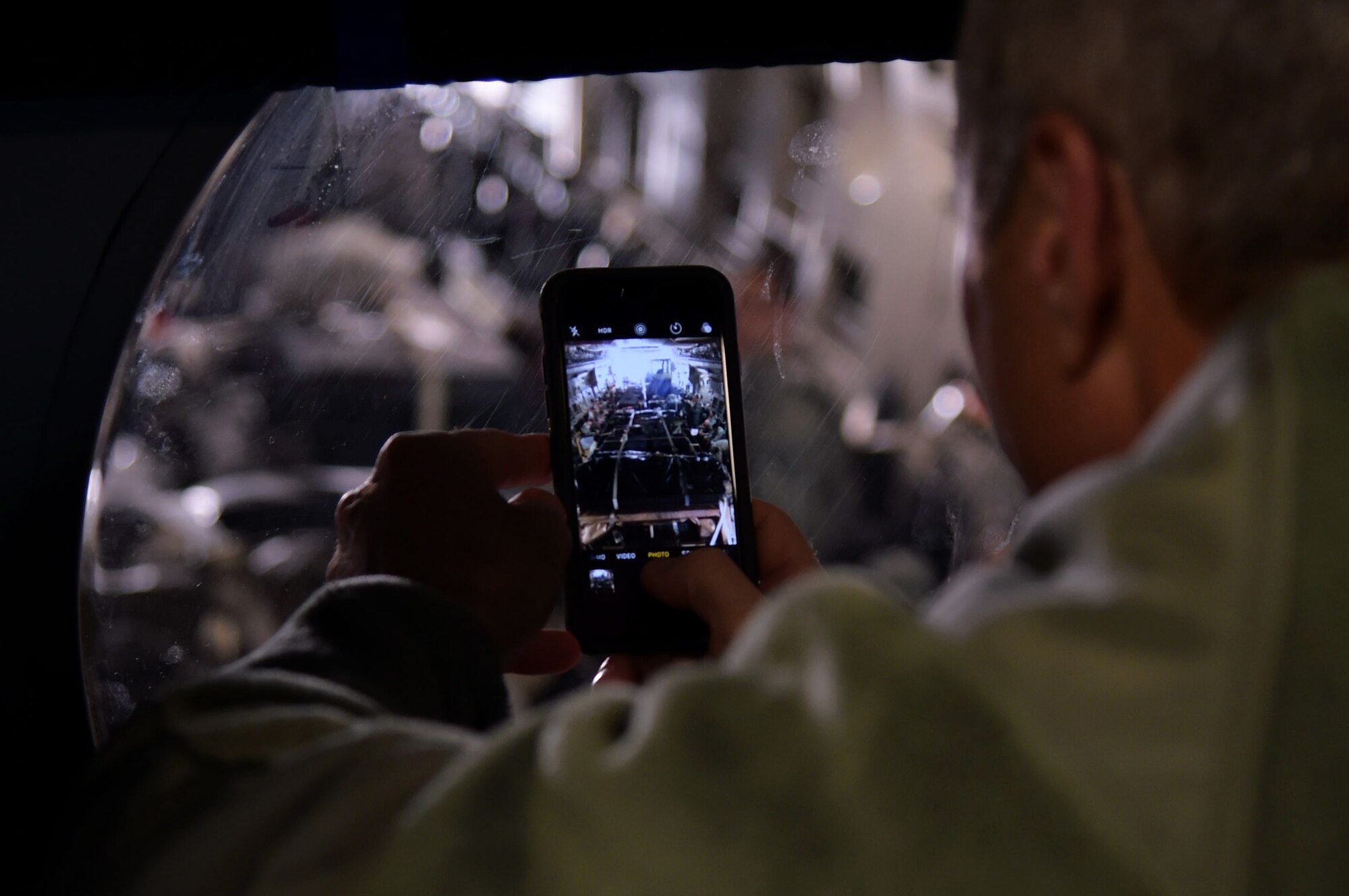 Col. Chuck Henderson, 621st Contingency Response Wing commander, takes a photo of Airmen assigned to the CRW in a C-17 Globemaster III before they depart to support humanitarian relief efforts in Port-au-Prince, Haiti, October 6, 2016. The CRW is supporting the government of Haiti's request for humanitarian assistance. (U.S. Air Force photo by Tech. Sgt. Gustavo Gonzalez/Released)