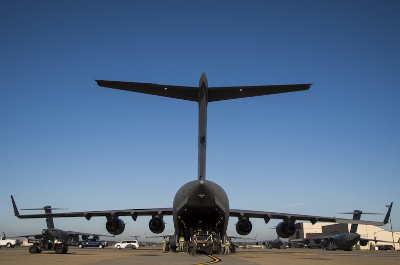 Members of the 621st Contingency Response Wing load equipment onto a C-17 Globemaster III at Joint Base McGuire-Dix-Lakehurst, N.J. before departing to support humanitarian relief efforts at Port-au-Prince, Haiti, October 6, 2016. More than 30 members of the CRW deployed in response to Hurricane Matthew. (U.S. Air Force photo by Tech. Sgt. Gustavo Gonzalez/Released)