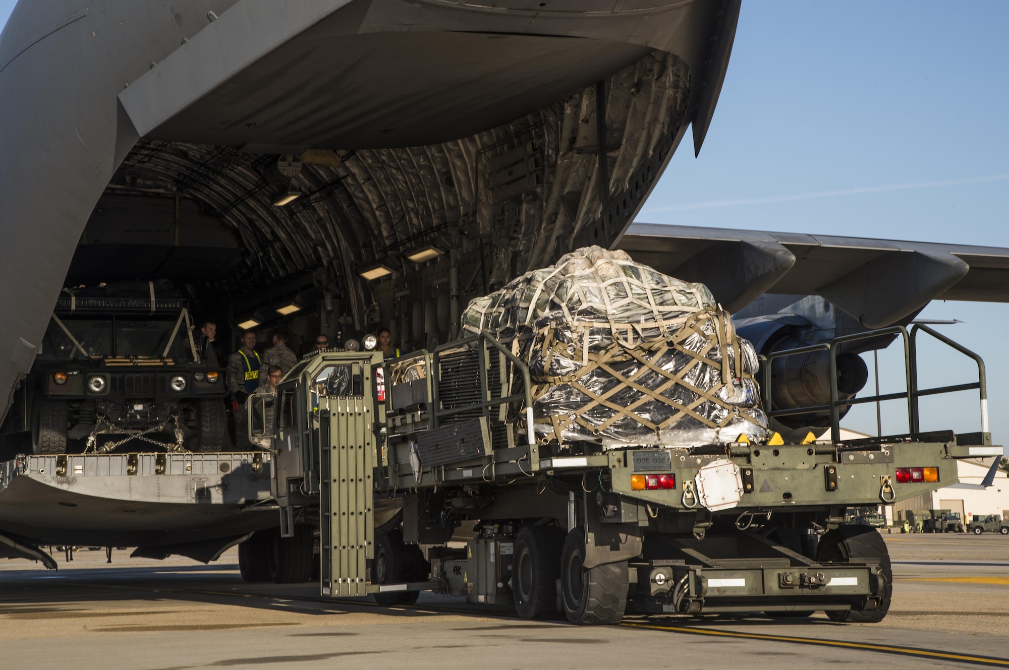 Equipment is loaded onto a C-17 Globemaster III at Joint Base McGuire-Dix-Lakehurst, N.J. for a 621st Contingency Response Wing deployment mission to Port-au-Prince, Haiti, October 6, 2016. More than 30 CRW members will meet up with U.S. Army Soldiers assigned to the 689th Rapid Port Opening Element and members of the Defense Logistics Agency at Joint Base Langley-Eustis, Va. (U.S. Air Force photo by Tech. Sgt. Gustavo Gonzalez)