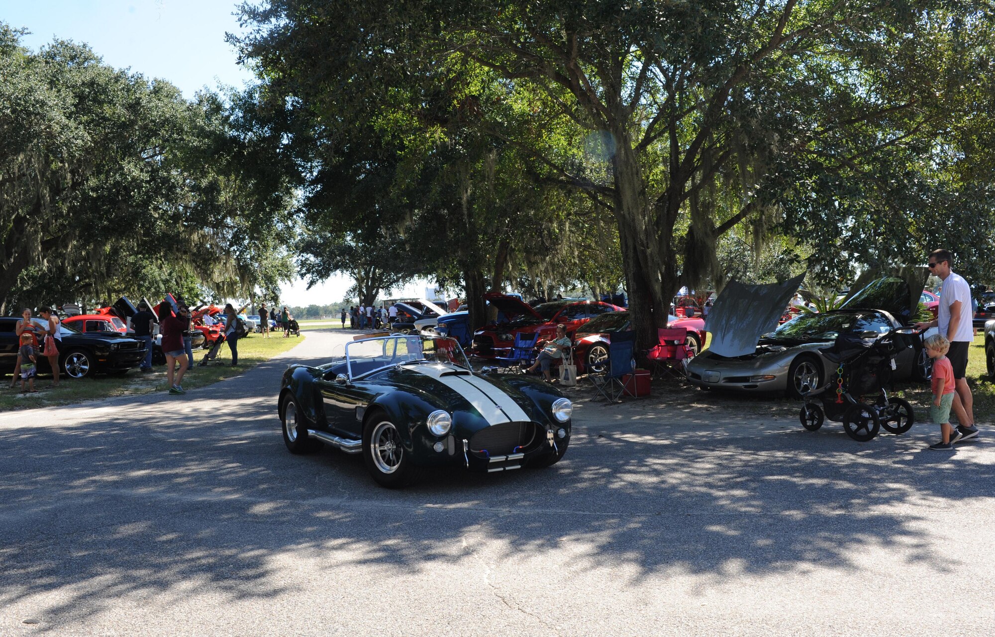 A 1970 Oldsmobile Cutless Supreme Convertible drives around marina park during the Cruisin’ Keesler 13th Annual Car Show Oct. 1, 2016, on Keesler Air Force Base, Miss. There were over 130 classic car, truck, bike and hot rod entries with more than 40 awards presented. (U.S. Air Force photo by Kemberly Groue/Released)