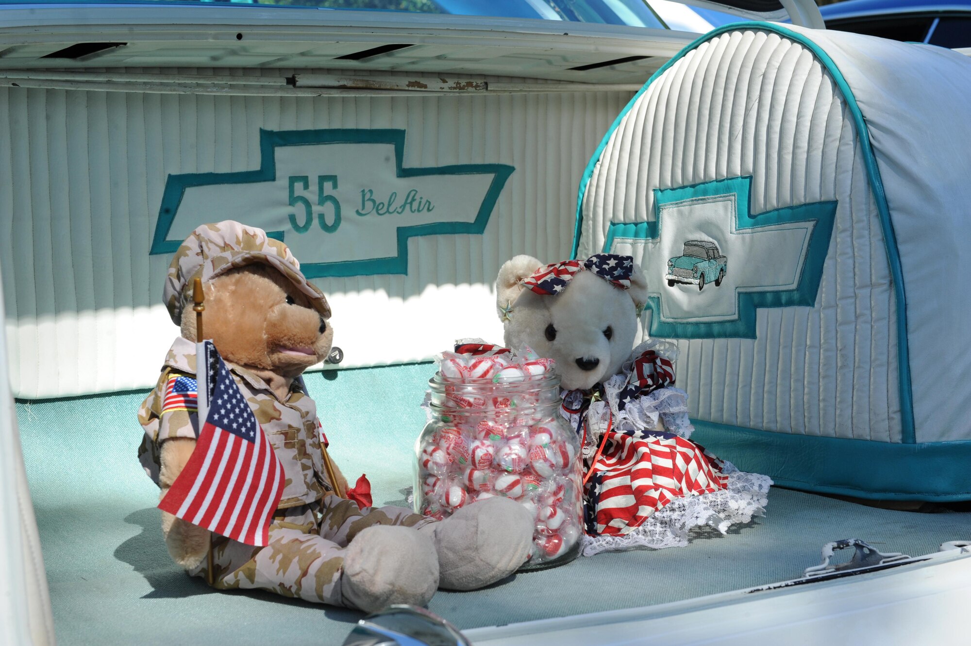 Patriotic stuffed animals and mints decorate the trunk of a 1955 Chevy Belair hard top as it sits on display at marina park during the Cruisin’ Keesler 13th Annual Car Show Oct. 1, 2016, on Keesler Air Force Base, Miss. There were over 130 classic car, truck, bike and hot rod entries with more than 40 awards presented. (U.S. Air Force photo by Kemberly Groue/Released)