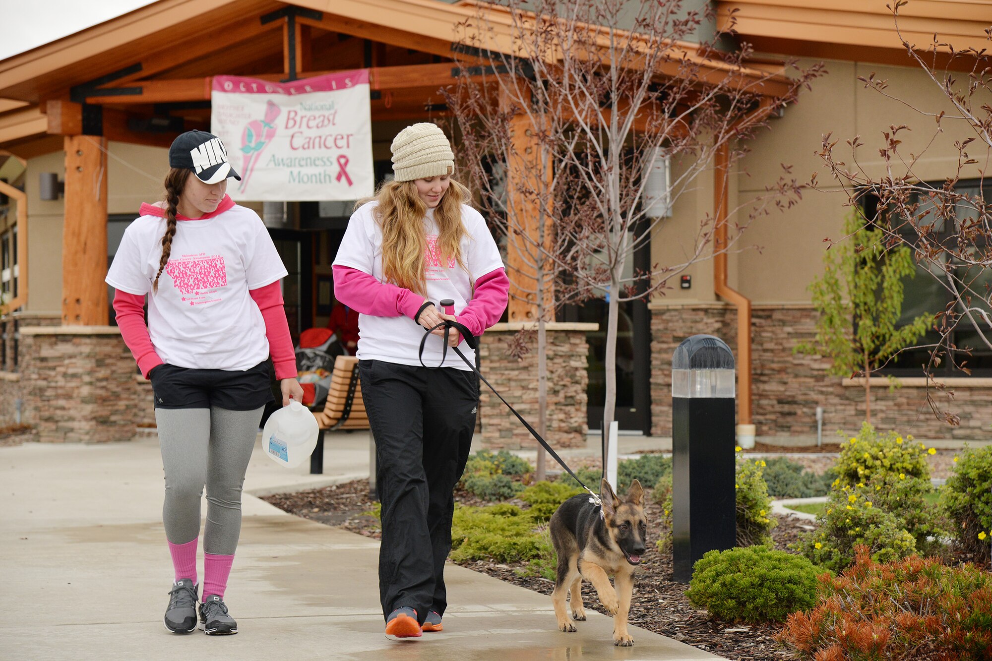 Participants walk with their dog in the annual Breast Cancer Awareness run and walk Oct. 5, 2016, at Malmstrom Air Force Base, Mont. The event is held each year to raise awareness for breast cancer and encourage men and women of all ages to be proactive with preventative health measures. (U.S. Air Force photo/Airman 1st Class Daniel Brosam)