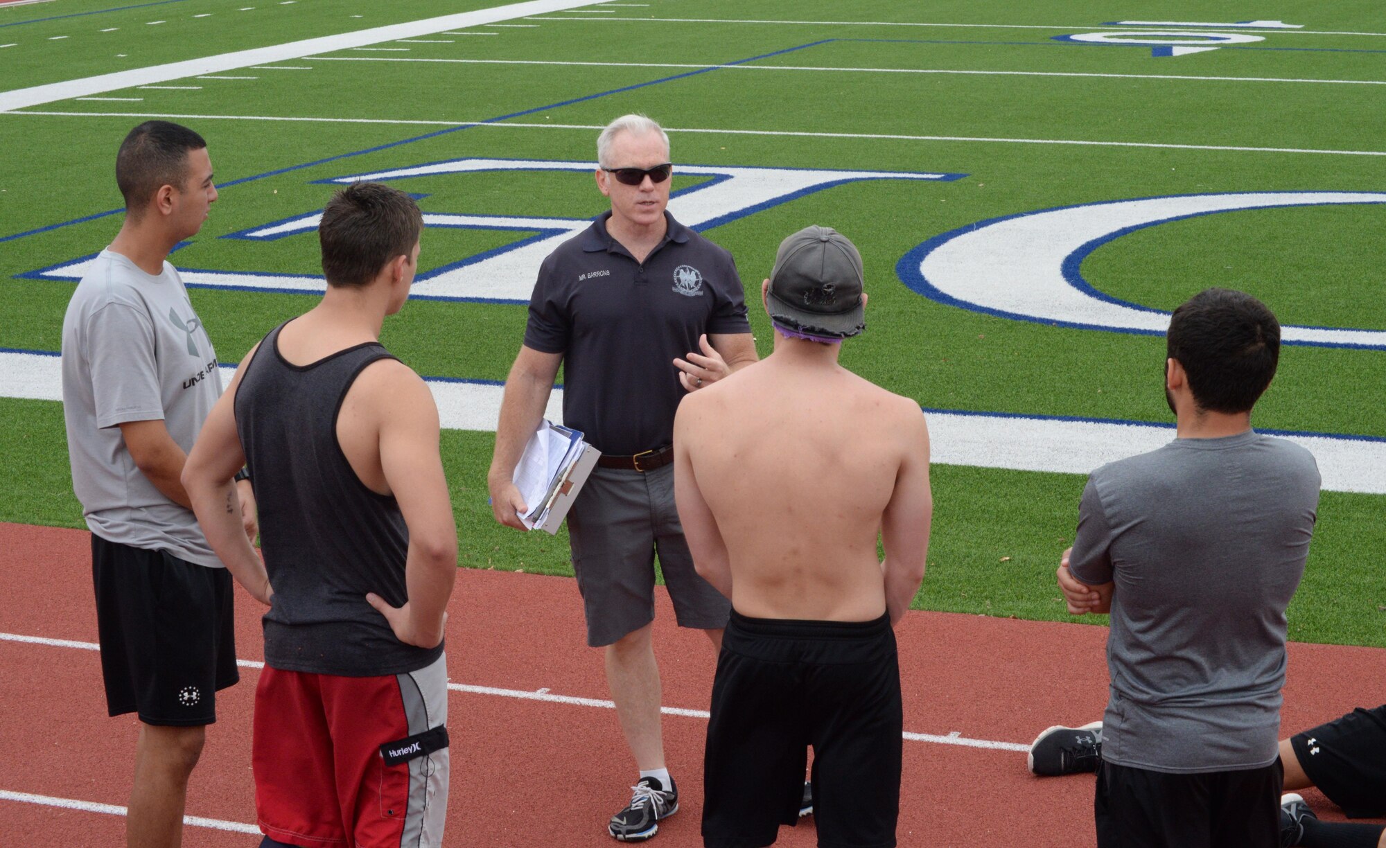 Steve Barrons, Air Force Special Operations developer, speaks to Special Operations and Combat Support candidates prior to their run test during the Physical Ability and Stamina Test in San Antonio, Texas, Sept. 8..