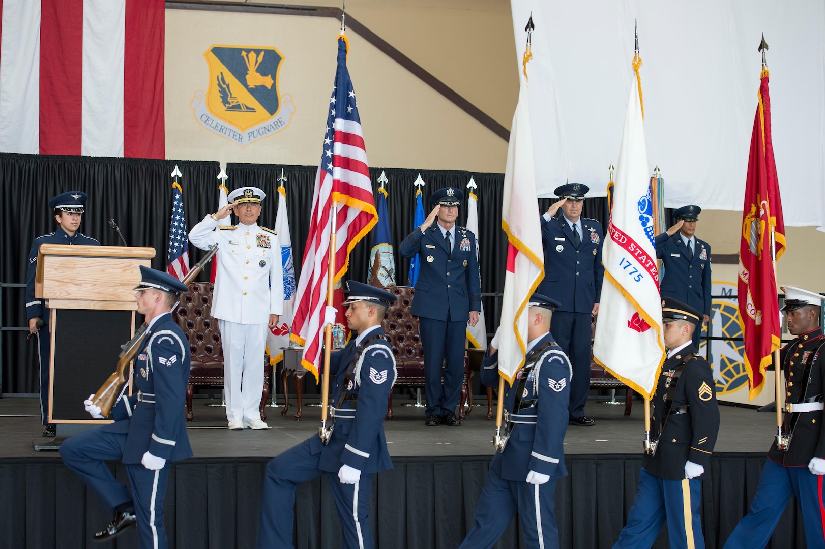 YOKOTA AIR BASE, Japan (Oct. 6, 2016) - Adm. Harry B. Harris, commander of U.S. Pacific Command, left, Gen. Terrence J. O’Shaughnessy, commander of Pacific Air Forces, Lt. Gen. Jerry Martinez renders honors during presentation of the Colors.  Martinez assumed the responsibilities as commander of USFJ and the 5th Air Force.