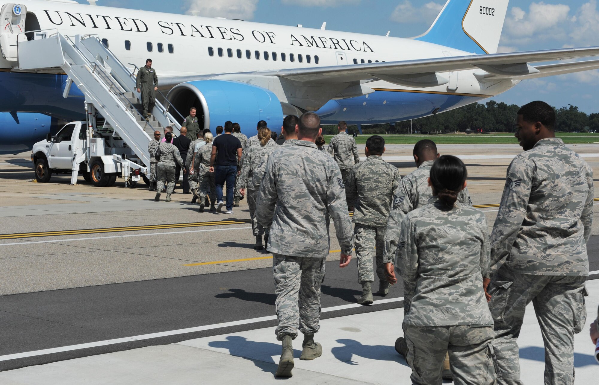 Keesler personnel prepare to board a C-32A for touring outside Base Operations Sept. 22, 2016, on Keesler Air Force Base, Miss. The 89th Operations Group, Joint Base Andrews, Md., landed the aircraft on Keesler for as an in-service recruiting opportunity enlisted members to become flight attendants. For more information on flight attendant careers, call the career assistance advisor at 228-377-3697. (U.S. Air Force photo by Kemberly Groue/Released)