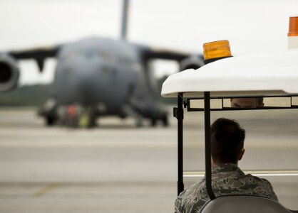 U.S. Air Force Master Sergeant Craig Carpenter, 437th Maintenance Group maintainer, inspects a Joint Base Charleston C-17 Globemaster III prior to it evacuating to Fort Campbell, KY on Oct. 6, 2016. Due to Hurricane Matthew, a Limited Evacuation Order of South Carolina Hurricane Evacuation Zones was issued by the Commander, Joint Base Charleston. All Joint Base personnel are expected to evacuate the area and will return once damage is assessed and it’s safe to return.
