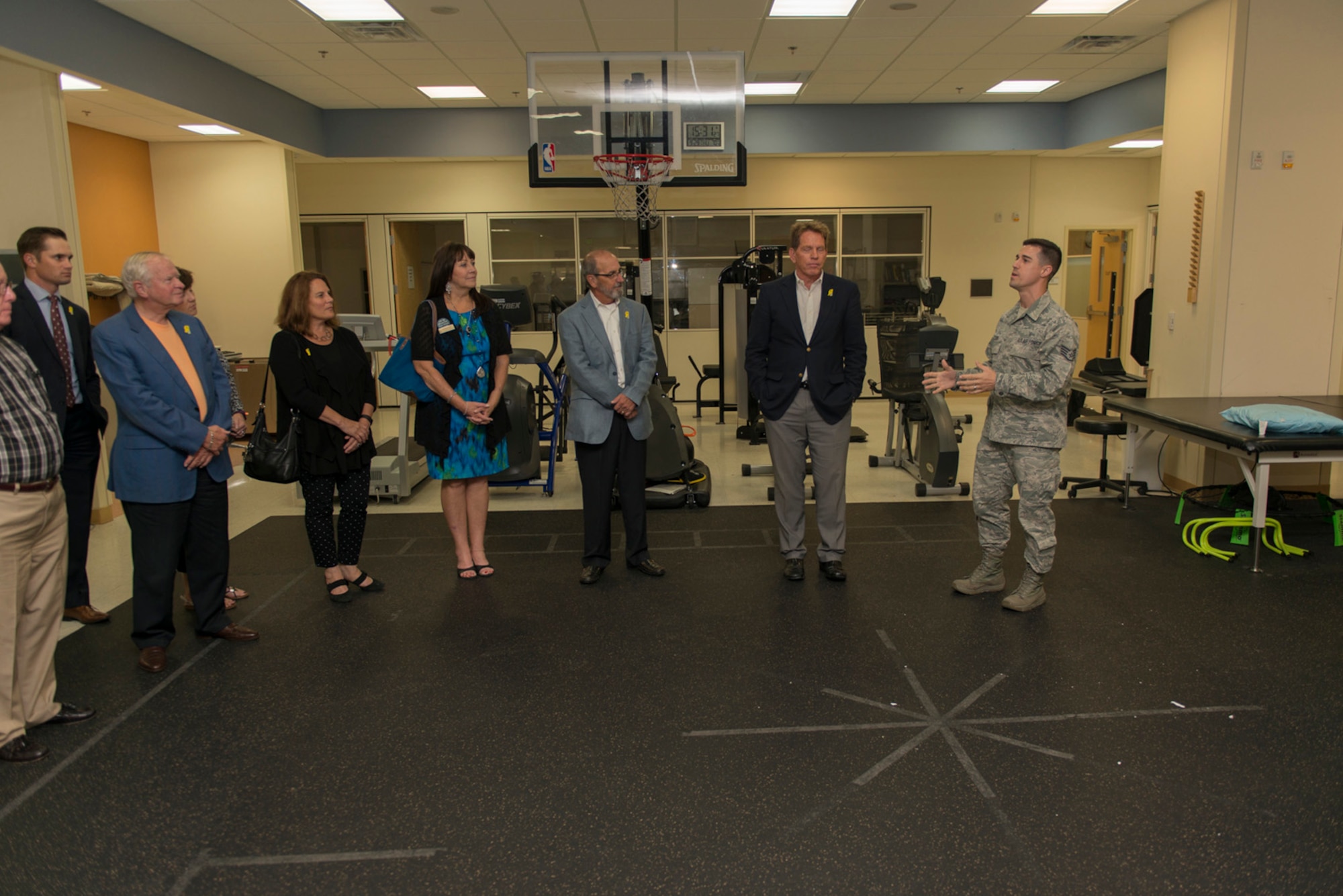 Staff Sgt. Wesley McCool, 81st Surgical Operations Squadron physical medicine technician, briefs 81st Training Wing leadership and honorary commanders about the importance of injury prevention and physical therapy at the Keesler Medical Center Sept. 29, 2016, on Keesler Air Force Base, Miss. The honorary commanders, who are local civilian civic and business leaders, toured the physical therapy clinic, emergency room and intensive care unit to learn more about the capabilities and mission of the 81st MDG. (U.S. Air Force photo by Andre’ Askew/Released)