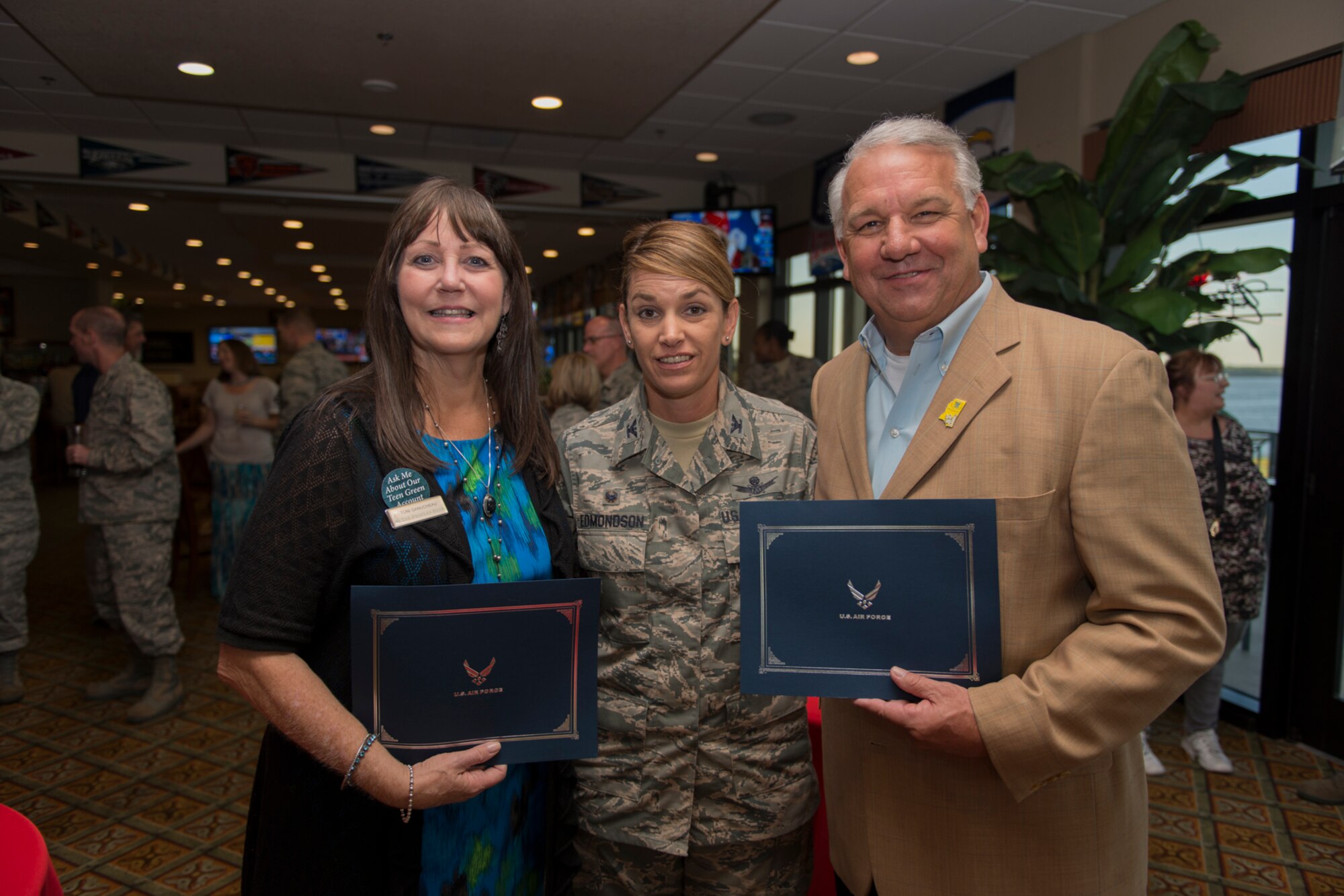 Col. Michele Edmondson, 81st Training Wing commander, presents Toni Ganucheau, The Peoples Bank branch manager, and Pastor Jeff Ulmer, New Life Family Church pastor, with certificates after inducting both as the newest 81st TRW honorary commanders at the Bay Breeze Event Center Sept. 29, 2016, on Keesler Air Force Base, Miss. The honorary commanders, who are local civilian civic and business leaders, toured the physical therapy clinic, emergency room and intensive care unit to learn more about the capabilities and mission of the 81st MDG. (U.S. Air Force photo by Andre’ Askew/Released)