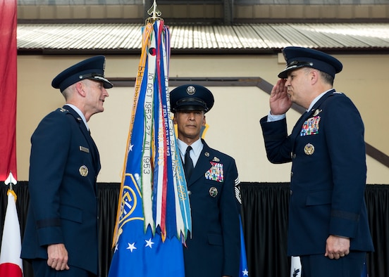 U.S. Air Force Lt. Gen. Jerry P. Martinez, incoming United States Forces, Japan and 5th Air Force commander, salutes Gen. Terrence J. O’Shaughnessy, Pacific Air Forces commander, before accepting the USAF and 5th Air Force guidon during his Assumption of Command ceremony October 6, 2016, at Yokota Air Base, Japan. Martinez was the former Headquarters Air Mobility Command director of operations at Scott Air Force Base, Ill. (U.S. Air Force photo by Airman 1st Class Donald Hudson/Released)