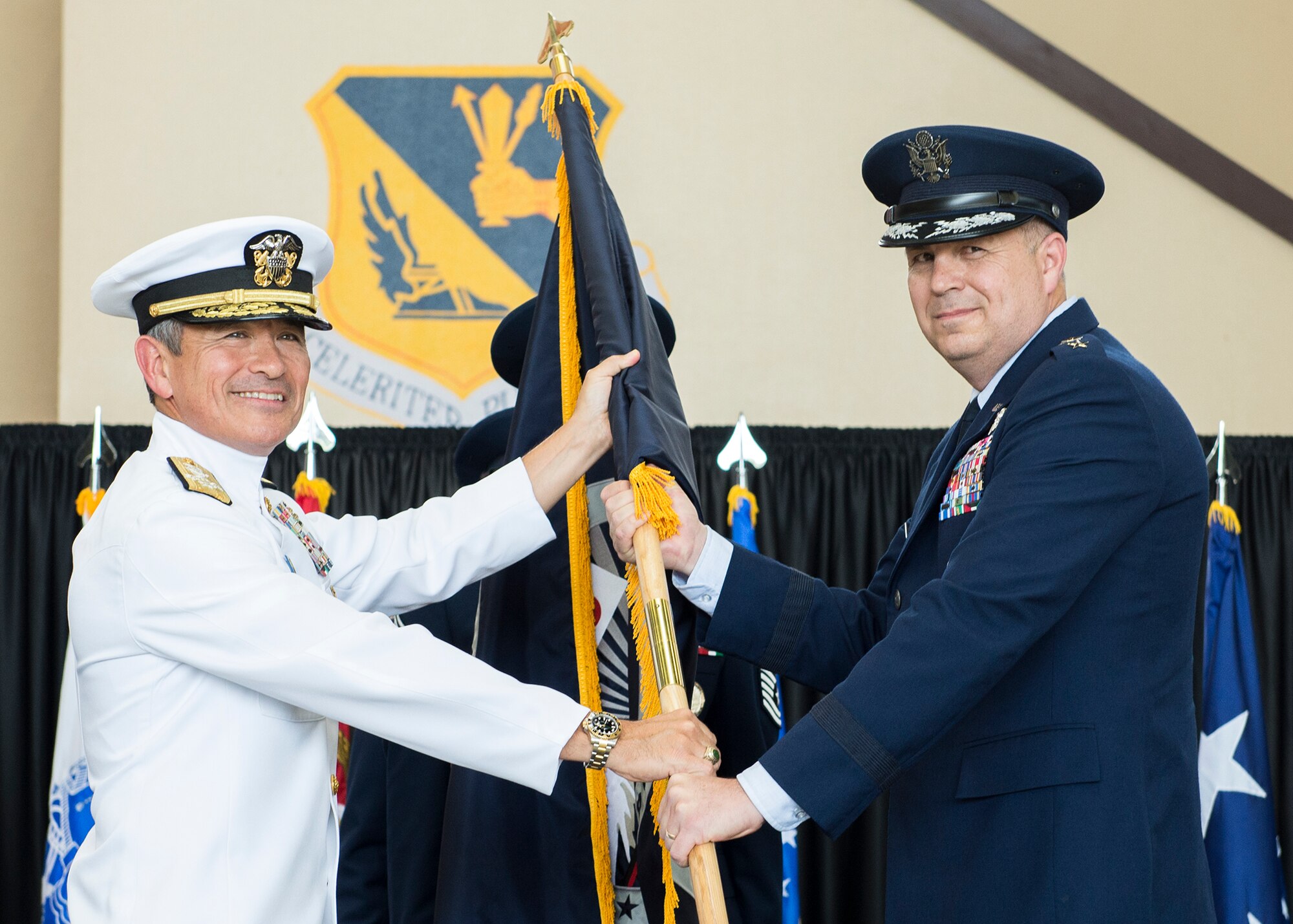 U.S. Air Force Lt. Gen. Jerry P. Martinez, incoming United States Forces, Japan and 5th Air Force commander, accepts the guidon from Adm. Harry B. Harris Jr., U.S. Pacific Command commander, during the Assumption of Command ceremony October 6, 2016, at Yokota Air Base, Japan. Harris and Gen. Terrence J. O’Shaughnessy, Pacific Air Forces commander, presided over the ceremony. (U.S. Air Force photo by Airman 1st Class Donald Hudson/Released)