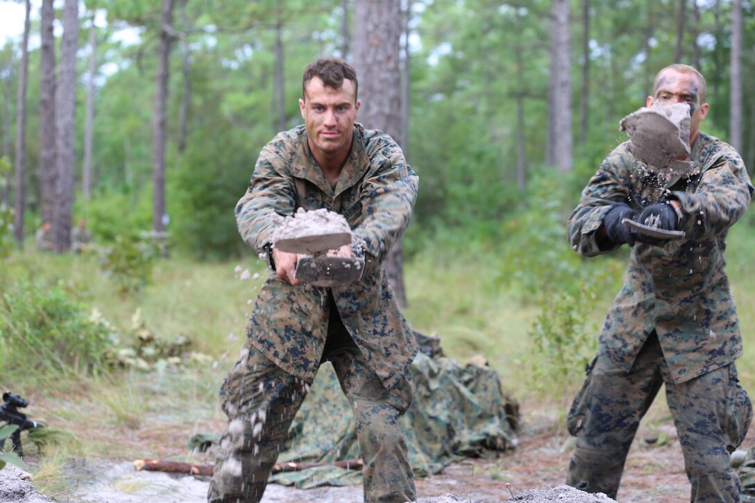 Marines dig fortifications in preparation for enemy contact during a field training exercise at Camp Lejeune, N.C., Sept. 27, 2016. The Marines conducted the defensive and offensive exercise to build upon their fortification techniques and offensive capabilities. The Marines conducting the training are with 2nd Battalion, 2nd Marine Regiment. (U.S. Marine Corps photo by Shannon Kroening)