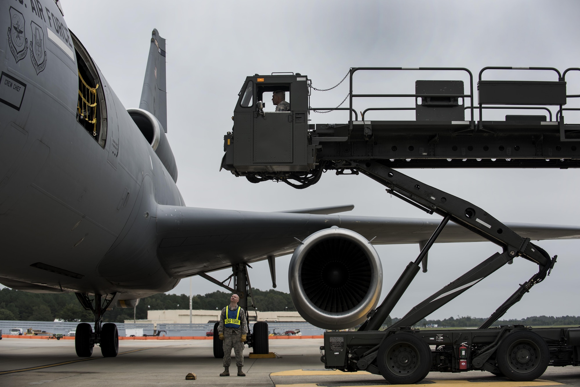 In preparation for Hurricane Matthew, Airmen position a K-Loader to unload cargo from a KC-10A Extender, Oct. 6, 2016, at Seymour Johnson Air Force Base, North Carolina. The aircraft arrived from Joint Base McGuire-Dix-Lakehurst, New Jersey, to help move essential equipment as more than 40 F-15E Strike Eagles and six KC-135R Stratotanker aircraft were repositioned to Barksdale Air Force Base, Louisiana, as a precautionary measure to avoid potential damage from high winds associated with Matthew. (U.S. Air Force photo by Senior Airman Brittain Crolley)