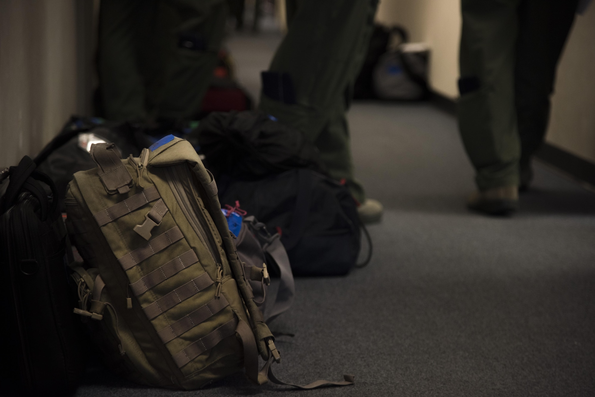 Aircrew members from the 334th Fighter Squadron prepare to evacuate as a precautionary measure due to Hurricane Matthew, Oct. 6, 2016, at Seymour Johnson Air Force Base, North Carolina. More than 40 F-15E Strike Eagles and six KC-135R Stratotanker aircraft were repositioned to Barksdale Air Force Base, Louisiana to avoid potential damage from high winds and rain associated with Matthew. (U.S. Air Force photo by Senior Airman Brittain Crolley)