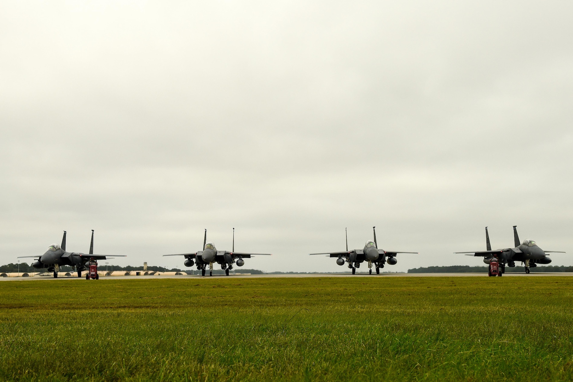 Four F-15E Strike Eagles from the 334th Fighter Squadron prepare to take off as a precautionary measure to avoid severe weather associated with Hurricane Matthew, Oct. 6, 2016, at Seymour Johnson Air Force Base, North Carolina. More than 40 F-15E Strike Eagles and six KC-135R Stratotanker aircraft were repositioned to Barksdale Air Force Base, Louisiana to avoid potential damage from severe weather associated with Matthew. (U.S. Air Force photo by Airman Shawna L. Keyes)