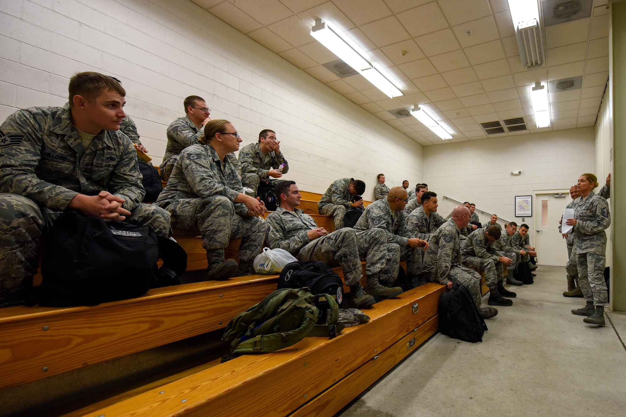 Master Sgt. Leslie Wagner (right), 4th Comptroller Squadron financial services flight chief, gives a brief to Team Seymour support personnel before they depart to Barksdale Air Force Base, Louisiana as a precautionary measure due to Hurricane Matthew, Oct. 6, 2016, at Seymour Johnson Air Force Base, North Carolina. More than 40 F-15E Strike Eagles and six KC-135R Stratotanker aircraft were repositioned to Barksdale Air Force Base, Louisiana to avoid potential damage from severe weather associated with Matthew. (U.S. Air Force photo by Airman Shawna L. Keyes)