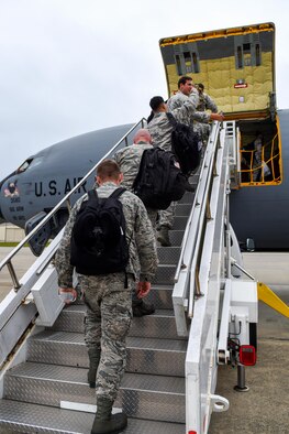 Members of Team Seymour board a KC-135R Stratotanker to depart the area as a precautionary measure due to Hurricane Matthew, Oct. 6, 2016, at Seymour Johnson Air Force Base, North Carolina. More than 40 F-15E Strike Eagles and six KC-135R Stratotanker aircraft were repositioned to Barksdale Air Force Base, Louisiana to avoid potential damage from severe weather associated with Matthew. (U.S. Air Force photo by Airman Shawna L. Keyes)