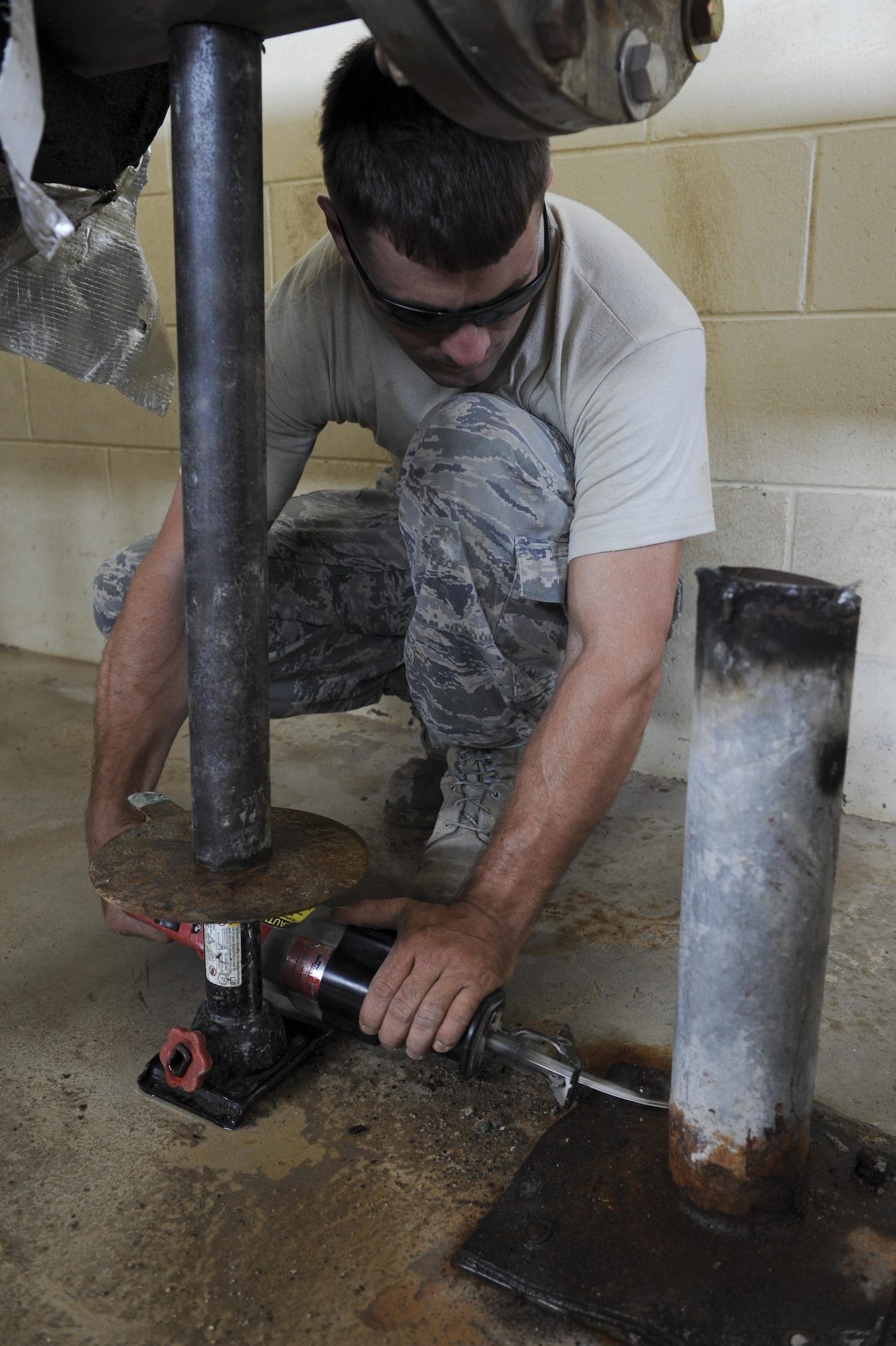 Staff Sgt. Kevin Waters, 8th Civil Engineering Squadron Liquid Fuels noncommissioned officer in charge, uses a reciprocating saw to remove bolts on an old elbow support stand at Kunsan Air Base, Republic of Korea, Oct. 6, 2016. 8th CES members are responsible for maintaining water treatment facilities throughout the base. These facilities provide airmen with potable water so they are continually able to Defend the Base, Accept Follow-On Forces and Take the Fight North. (U.S. Air Force photo by Senior Airman Michael Hunsaker/Released)