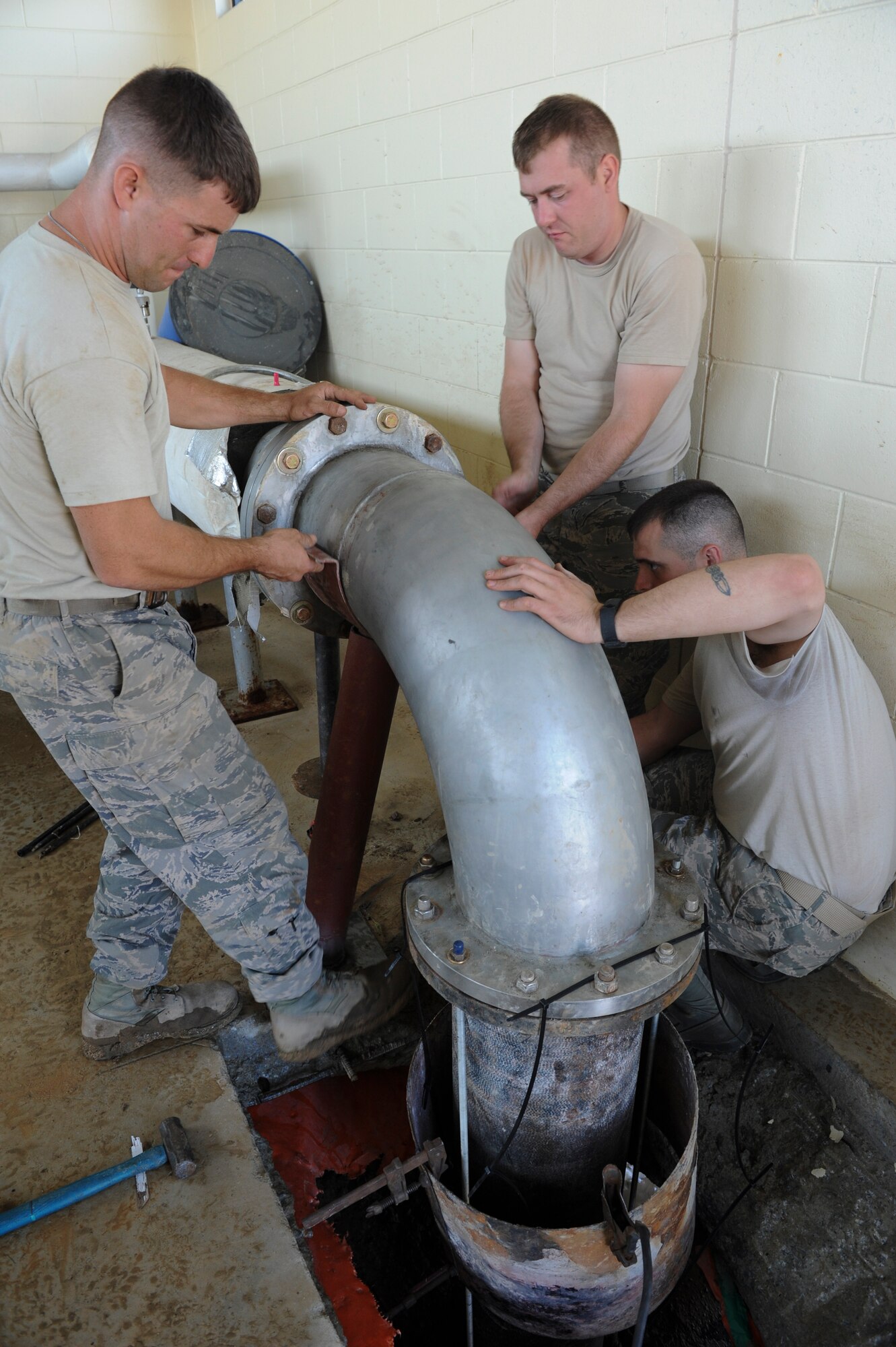 Staff Sgt. Kevin Waters, 8th Civil Engineering Squadron Liquid Fuels noncommissioned officer in charge, uses a reciprocating saw to remove bolts on an old elbow support stand at Kunsan Air Base, Republic of Korea, Oct. 6, 2016. 8th CES members are responsible for maintaining water treatment facilities throughout the base. These facilities provide airmen with potable water so they are continually able to Defend the Base, Accept Follow-On Forces and Take the Fight North. (U.S. Air Force photo by Senior Airman Michael Hunsaker/Released)
