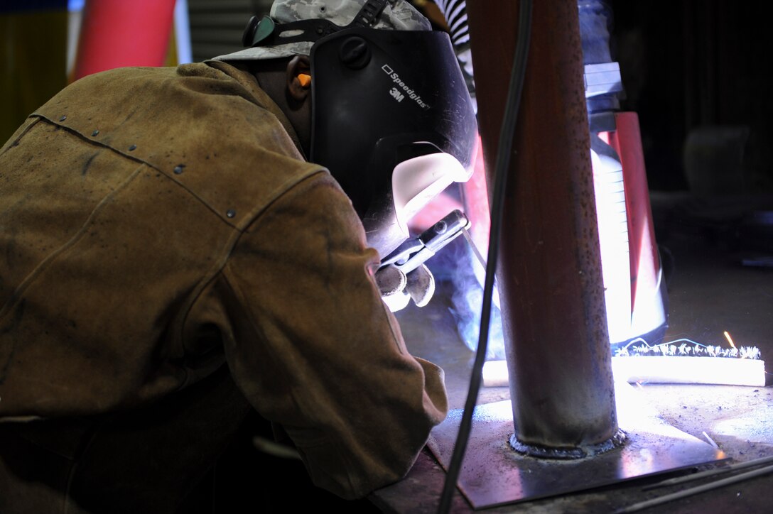 Senior Airman Gilbert Julian, 8th Civil Engineering Squadron Structures journeyman, welds an elbow support stand at Kunsan Air Base, Republic of Korea, Oct. 6, 2016. 8th CES members are responsible for maintaining water treatment facilities throughout the base. These facilities provide airmen with potable water so they are continually able to Defend the Base, Accept Follow-On Forces and Take the Fight North. (U.S. Air Force photo by Senior Airman Michael Hunsaker/Released)