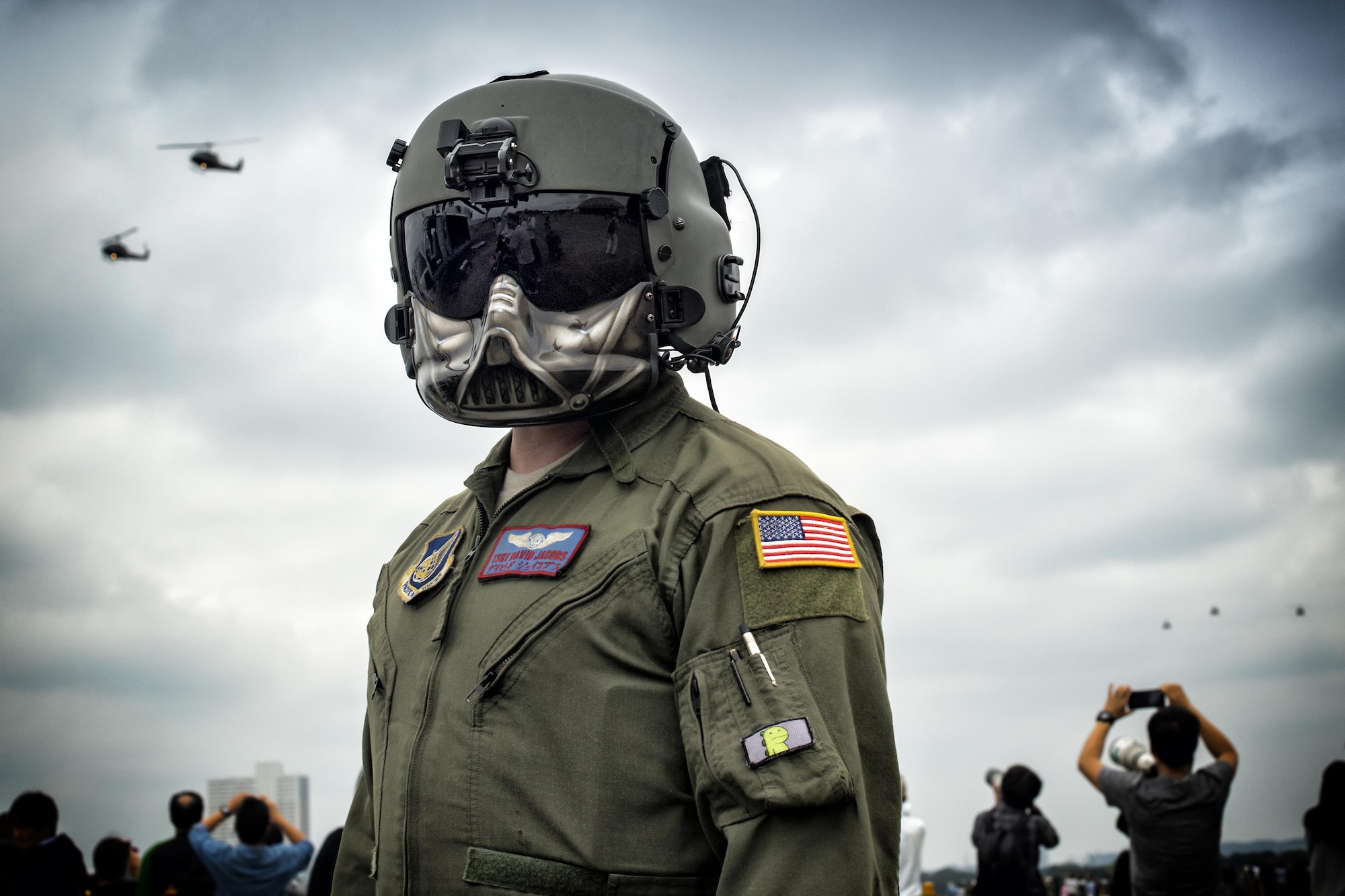 U.S. Air Force Tech. Sgt. David Jacob, 459th Airlift Squadron special mission aviator, participates in the 43rd Anniversary Event of Japan Ground Self-Defense Force Camp Tachikawa at JGSDF Camp Tachikawa, Japan, Oct. 1, 2016. JGSDF UH-1Js assigned to Eastern Army Helicopter demonstrated flight formations, hoist techniques and disaster relief procedures with first responders. Service members with the 459th Airlift Squadron from Yokota Air Base and Army Aviation Battalion from Camp Zama participated in the festival. (U.S. Air Force photo by Yasuo Osakabe/Released)
