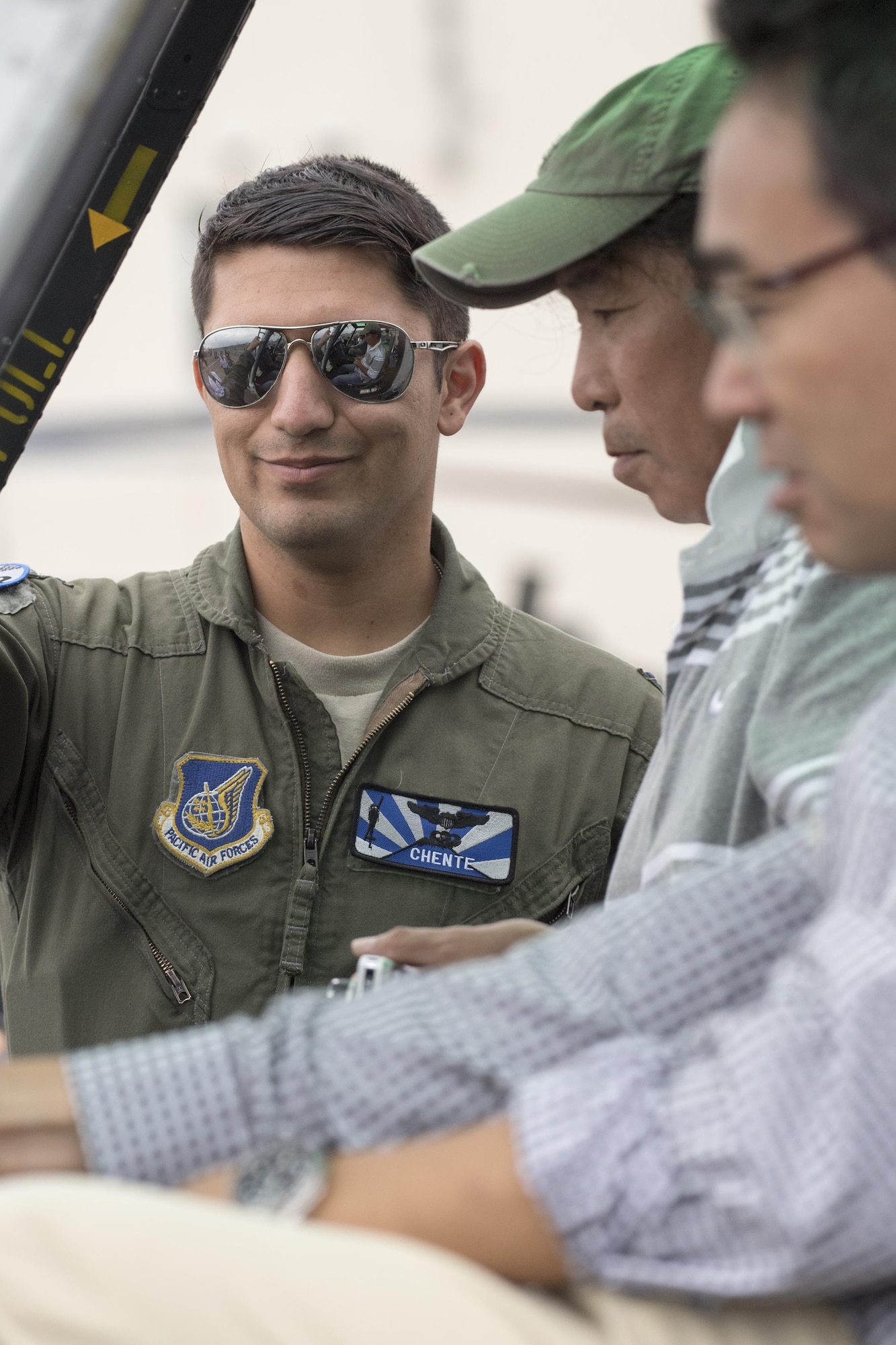 U.S. Air Force Capt. Vicente Vasquez, 459th Airlift Squadron UH-1N pilot, gives festival attendees a tour of the UH-1N Iroquois during the 43rd Anniversary Event of Japan Ground Self-Defense Force Camp Tachikawa at JGSDF Camp Tachikawa, Japan, Oct. 1, 2016. Service members with the 459th Airlift Squadron from Yokota Air Base and Army Aviation Battalion from Camp Zama participated in the festival. (U.S. Air Force photo by Yasuo Osakabe/Released)