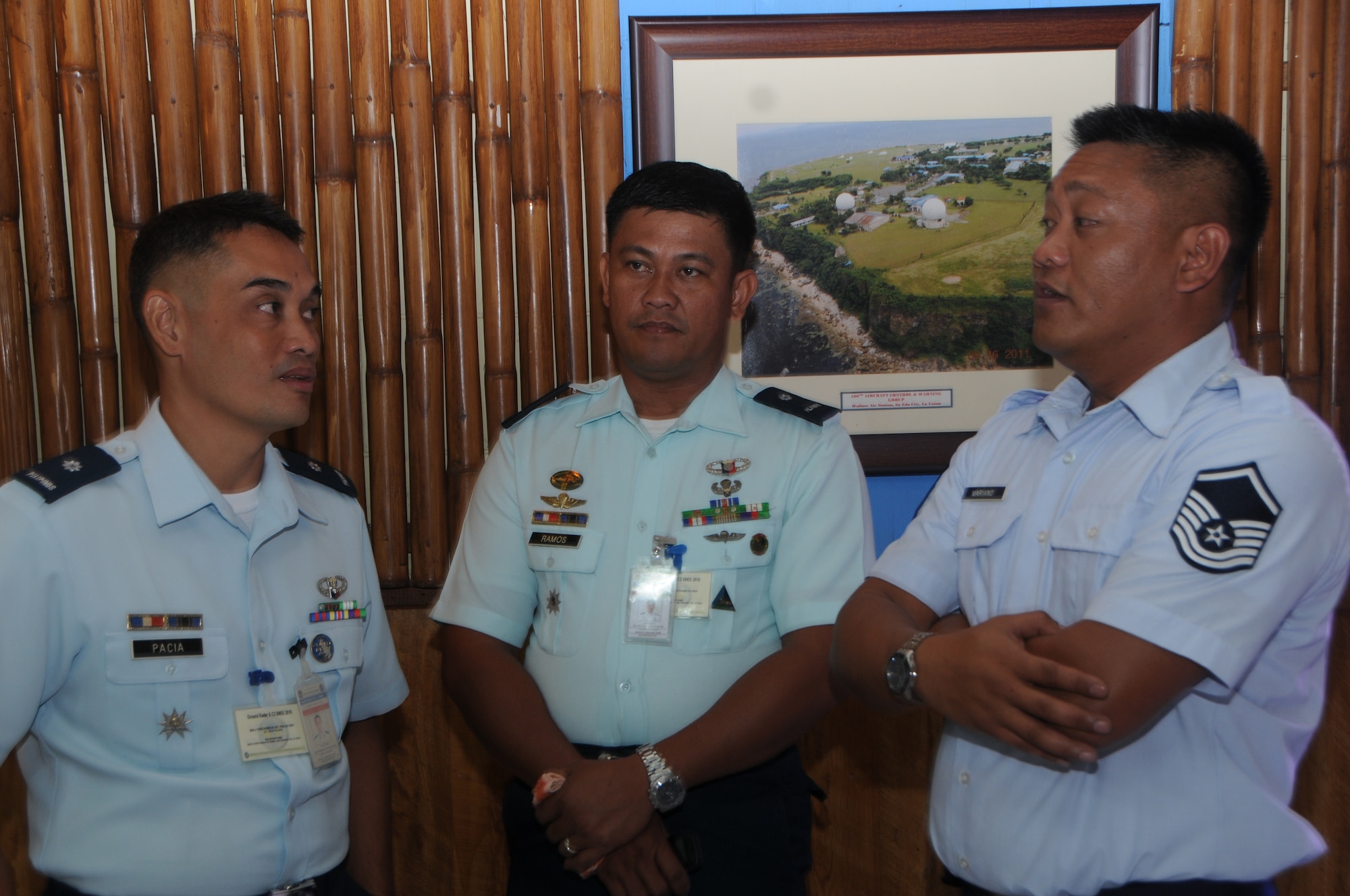 Philippine Air Force Maj. Frederick Pacia and PAF Maj. Nestor Ramos discuss radar maintanence with Master Sgt. Gino Marianno a radar maintanence technician assigned to the 169th Air Defense Squadron during a State Partnership Program subject matter expert change at Wallace Air Station, Aug. 29, 2016. The State Partnership Program is a National Guard program that links a state's national guard with a partner country to help build capacity and security cooperation. (U.S. Air National Guard photo by Senior Airman Orlando Corpuz/released) 