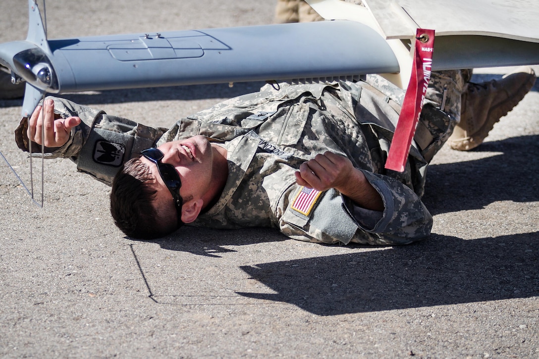 A soldier conducts preflight checks on an unmanned aerial system during Raptor Fury, a training exercise to evaluate mission readiness, at Orchard Combat Training Center, Idaho, Oct. 1, 2016. The soldier is assigned to the 7th Infantry Division’s 16th Combat Aviation Brigade. Army photo by Capt. Brian Harris
