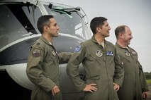 (Left to right) U.S. Air Force Capt. Jonathan Bonilla, Capt. Vicente Vasquez and Tech. Sgt. David Jacob, 459th Airlift Squadron UH-1N aircrew, watch a helicopter taking off during the 43rd Anniversary Event of Japan Ground Self-Defense Force Camp Tachikawa at JGSDF Camp Tachikawa, Japan, Oct. 1, 2016. Service members with the 459th Airlift Squadron from Yokota Air Base and Army Aviation Battalion from Camp Zama participated in the festival. (U.S. Air Force photo by Yasuo Osakabe/Released) 