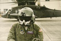 U.S. Air Force Tech. Sgt. David Jacob, 459th Airlift Squadron special mission aviator, completes pre-flight inspection display during the 43rd Anniversary Event of Japan Ground Self-Defense Force Camp Tachikawa at JGSDF Camp Tachikawa, Japan, Oct. 1, 2016. Service members with the 459th Airlift Squadron from Yokota Air Base and Army Aviation Battalion from Camp Zama participated in the festival. (U.S. Air Force photo by Yasuo Osakabe/Released)