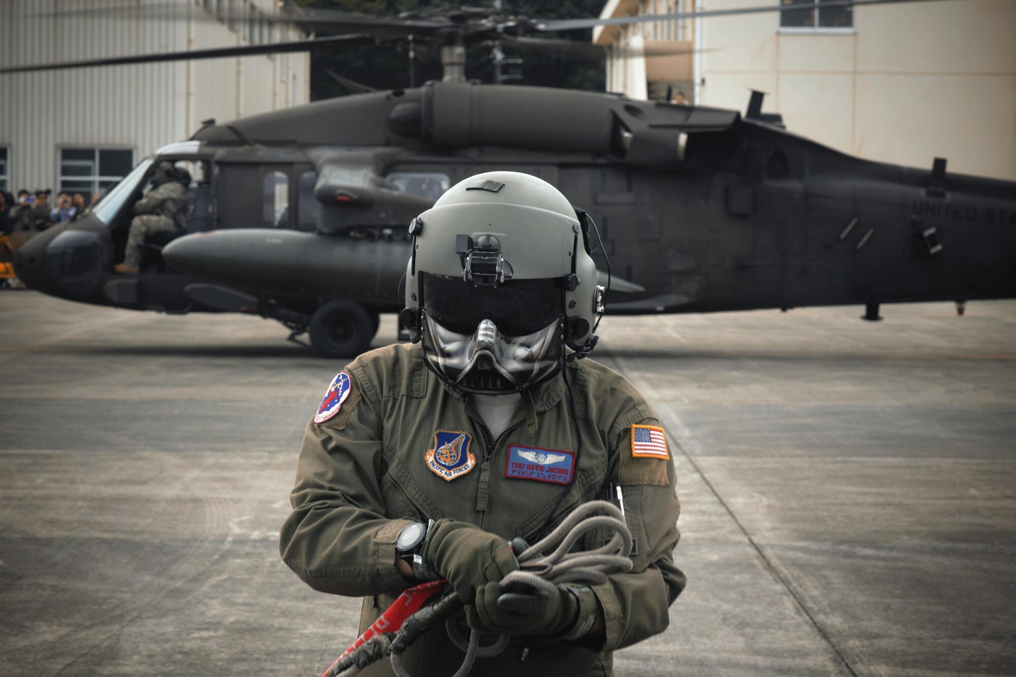 U.S. Air Force Tech. Sgt. David Jacob, 459th Airlift Squadron special mission aviator, completes pre-flight inspection display during the 43rd Anniversary Event of Japan Ground Self-Defense Force Camp Tachikawa at JGSDF Camp Tachikawa, Japan, Oct. 1, 2016. Service members with the 459th Airlift Squadron from Yokota Air Base and Army Aviation Battalion from Camp Zama participated in the festival. (U.S. Air Force photo by Yasuo Osakabe/Released)