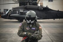 U.S. Air Force Tech. Sgt. David Jacob, 459th Airlift Squadron special mission aviator, completes pre-flight inspection display during the 43rd Anniversary Event of Japan Ground Self-Defense Force Camp Tachikawa at JGSDF Camp Tachikawa, Japan, Oct. 1, 2016. Service members with the 459th Airlift Squadron from Yokota Air Base and Army Aviation Battalion from Camp Zama participated in the festival. (U.S. Air Force photo by Yasuo Osakabe/Released)