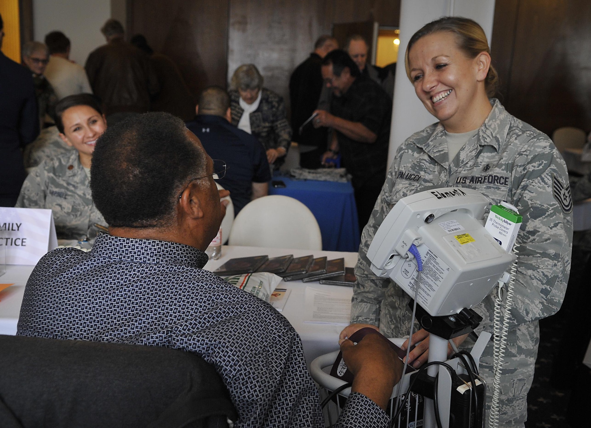 Medical personnel talk with a retiree during a Retiree Appreciation Week event at Ramstein Air Base, Germany, Oct. 4, 2016. The event provided a one-stop-shop for the retirees to take care of questions they may have about medical or legal matters as well as receive financial assistance and flu shots. (U.S. Air Force photo by Senior Airman Larissa Greatwood)